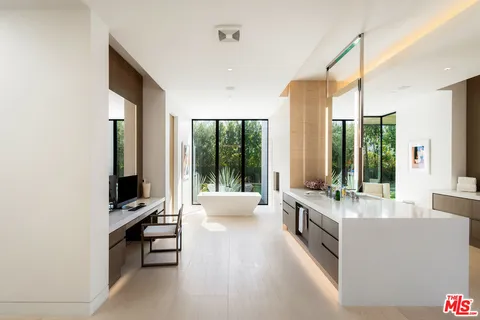 a view of swimming pool with a table and chair