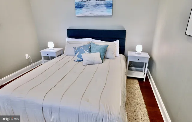 a bedroom with bed and window