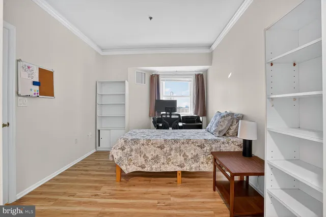 a room with a bed and furniture