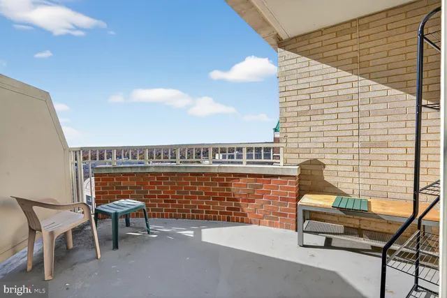 a view of a terrace with couple of chairs