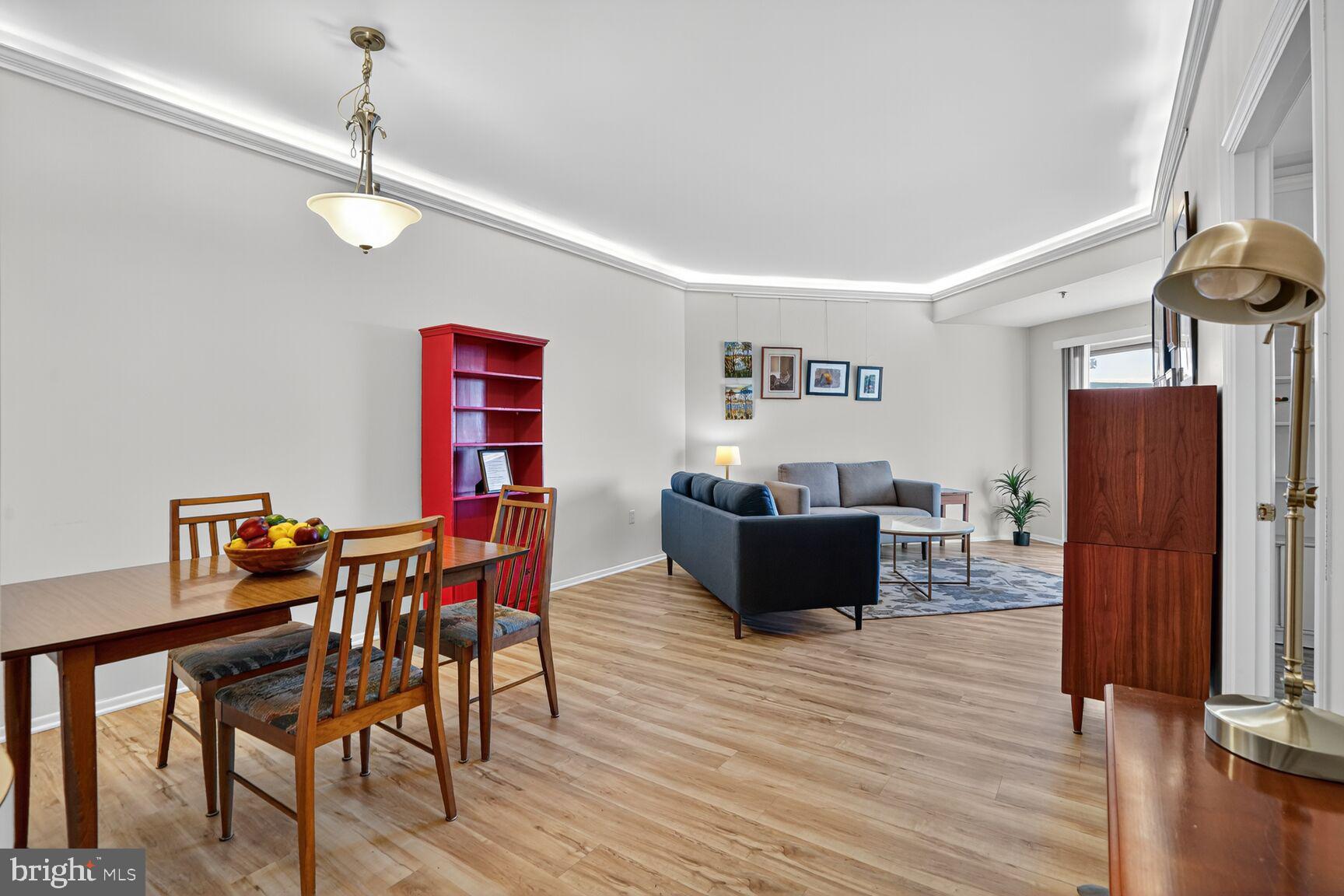 900 North Taylor Street, Unit 2110 Arlington, VA 22203 - Photo 8 of 42 a living room with furniture and a wooden floor