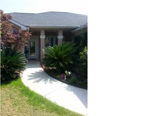 a view of house with yard