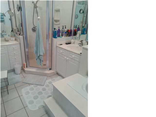 425 Golf Club Drive Santa Rosa Beach, FL 32459 - Photo 14 of 23 a bathroom with a sink and a mirror