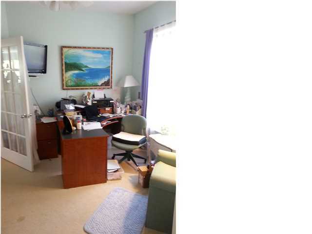 425 Golf Club Drive Santa Rosa Beach, FL 32459 - Photo 18 of 23 a living room with couches and a flat screen tv