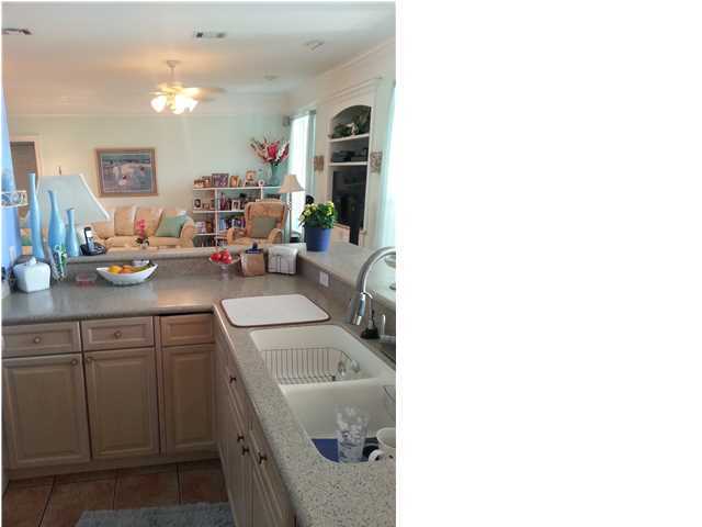 425 Golf Club Drive Santa Rosa Beach, FL 32459 - Photo 21 of 23 a kitchen with a sink cabinets and a couch