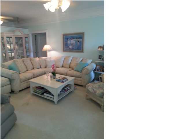 425 Golf Club Drive Santa Rosa Beach, FL 32459 - Photo 5 of 23 a living room with furniture and a table