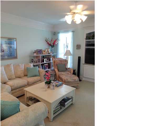425 Golf Club Drive Santa Rosa Beach, FL 32459 - Photo 6 of 23 a living room with furniture and a chandelier