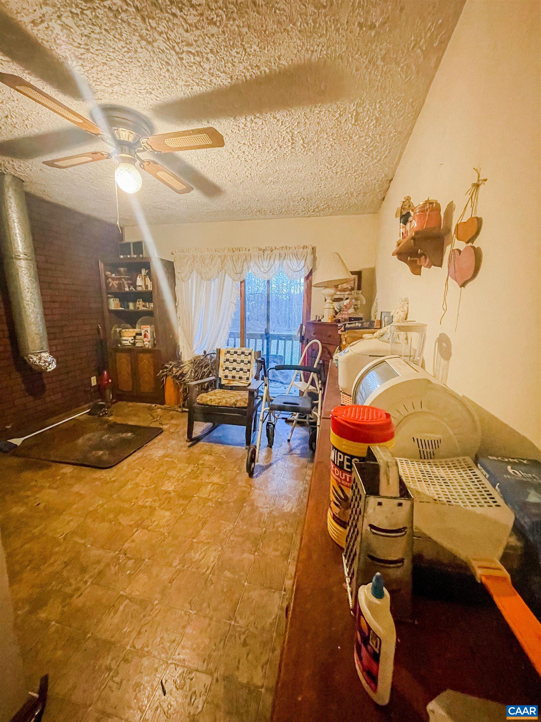 89 1 Horse Road Buckingham, VA 23921 - Photo 14 of 15 a room with furniture and a flat screen tv