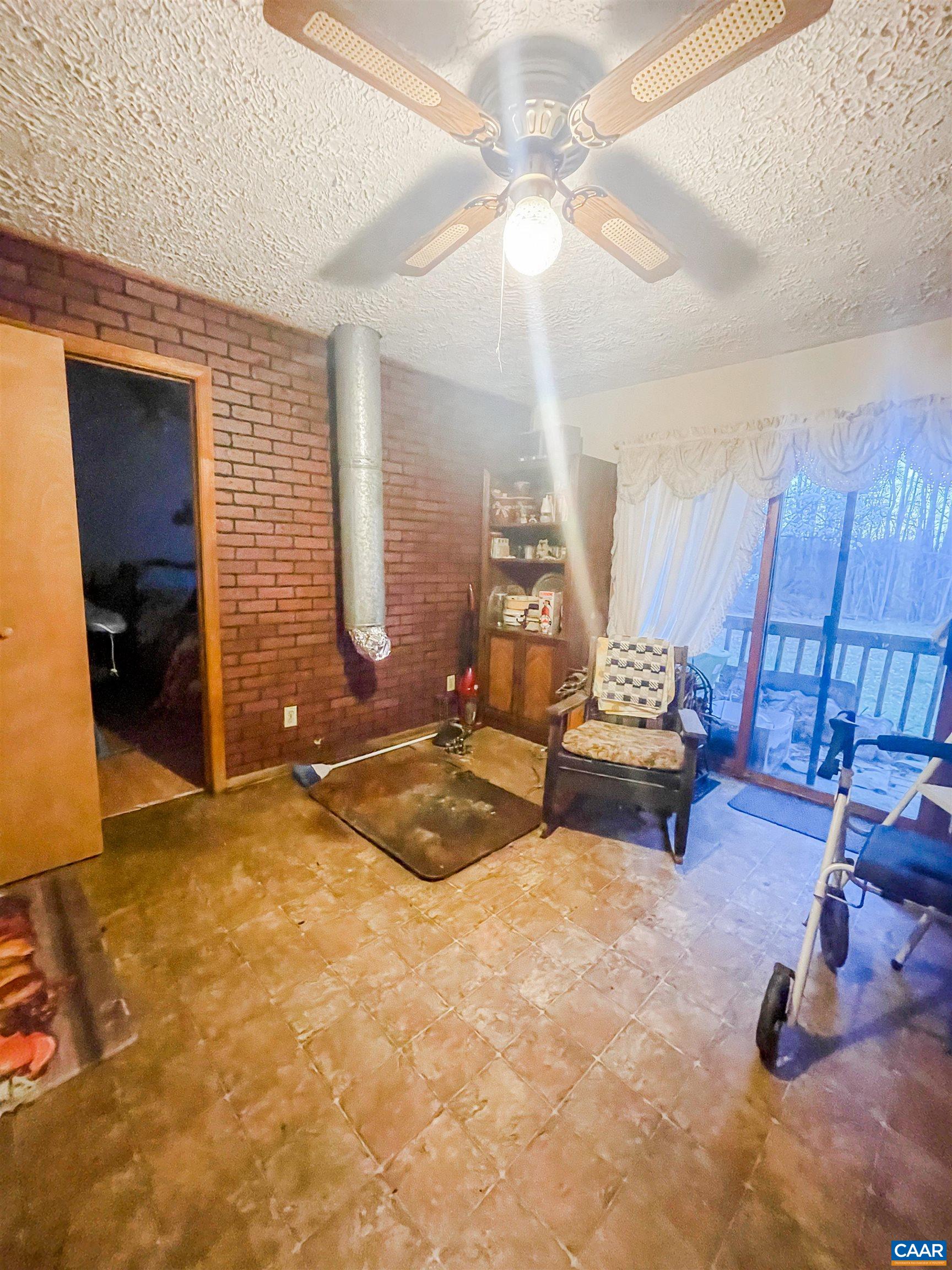 89 1 Horse Road Buckingham, VA 23921 - Photo 15 of 15 a bedroom with furniture and a chandelier
