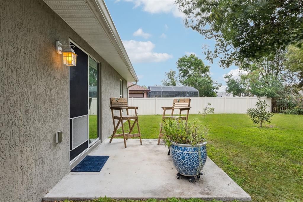 1049 Pinder Street Deltona, FL 32725 - Photo 15 of 20 a view of a house with backyard and sitting area