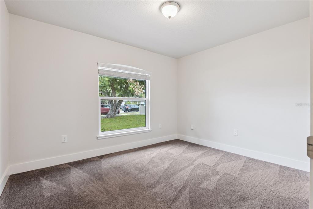 1049 Pinder Street Deltona, FL 32725 - Photo 16 of 20 an empty room with windows