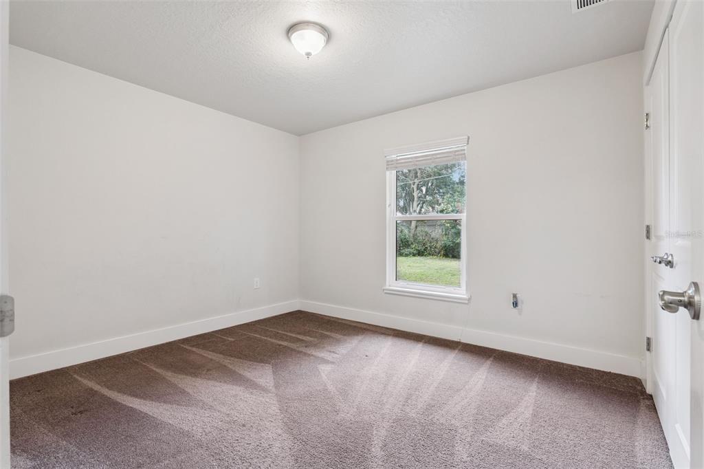 1049 Pinder Street Deltona, FL 32725 - Photo 17 of 20 an empty room with a window