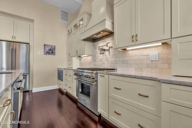 a bedroom with a large bed and furniture