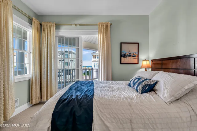 a bed room with a bed and a window