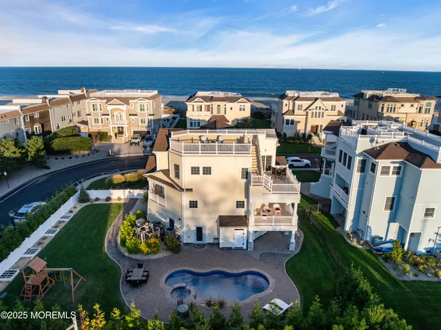 a view of a swimming pool with a yard