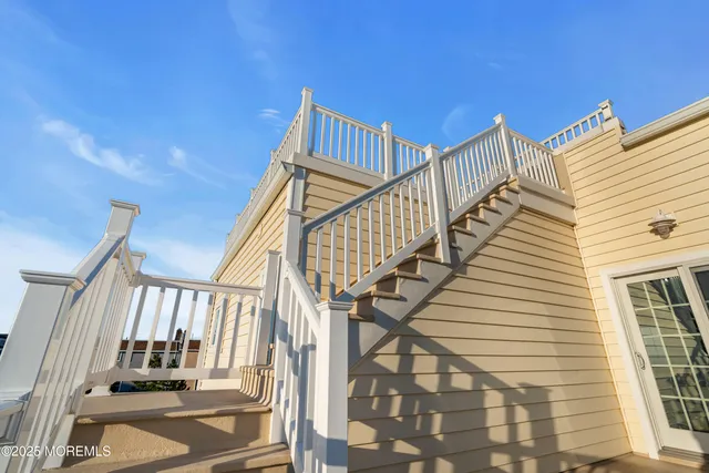 a view of bathroom with a sink and mirror