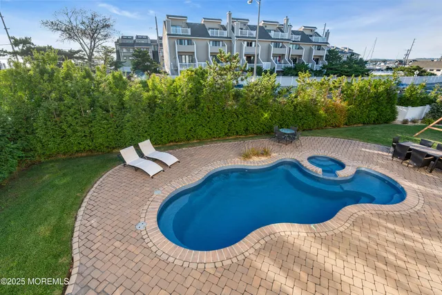 a view of a hallway with wooden floor and stairs