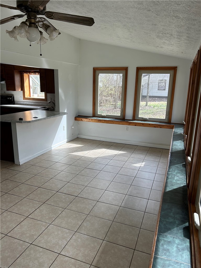 1358 Hanes Road Dayton, OH 45434 - Photo 6 of 21 This bright room features durable tile flooring, vaulted ceilings, and ample natural light.