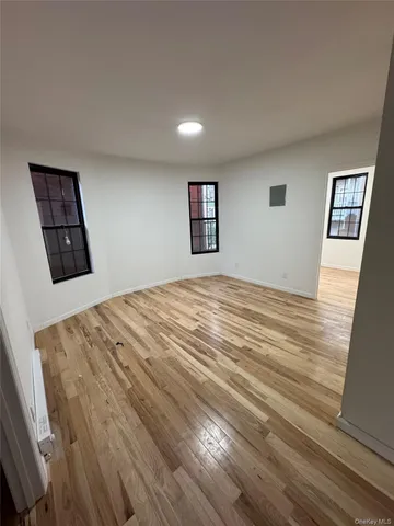 a bedroom with a bed and a view of kitchen