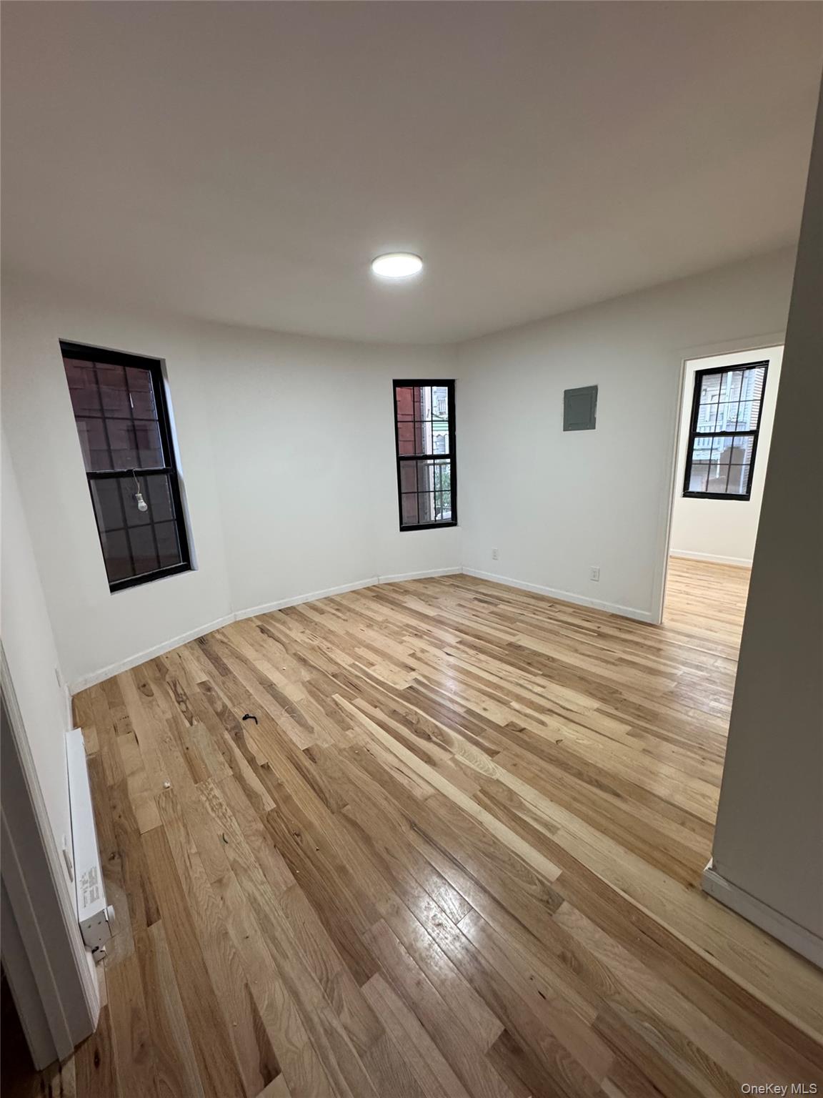 1827 Amethyst Street, Unit 2 Bronx, NY 10462 - Photo 2 of 9 a bedroom with a bed and a view of kitchen