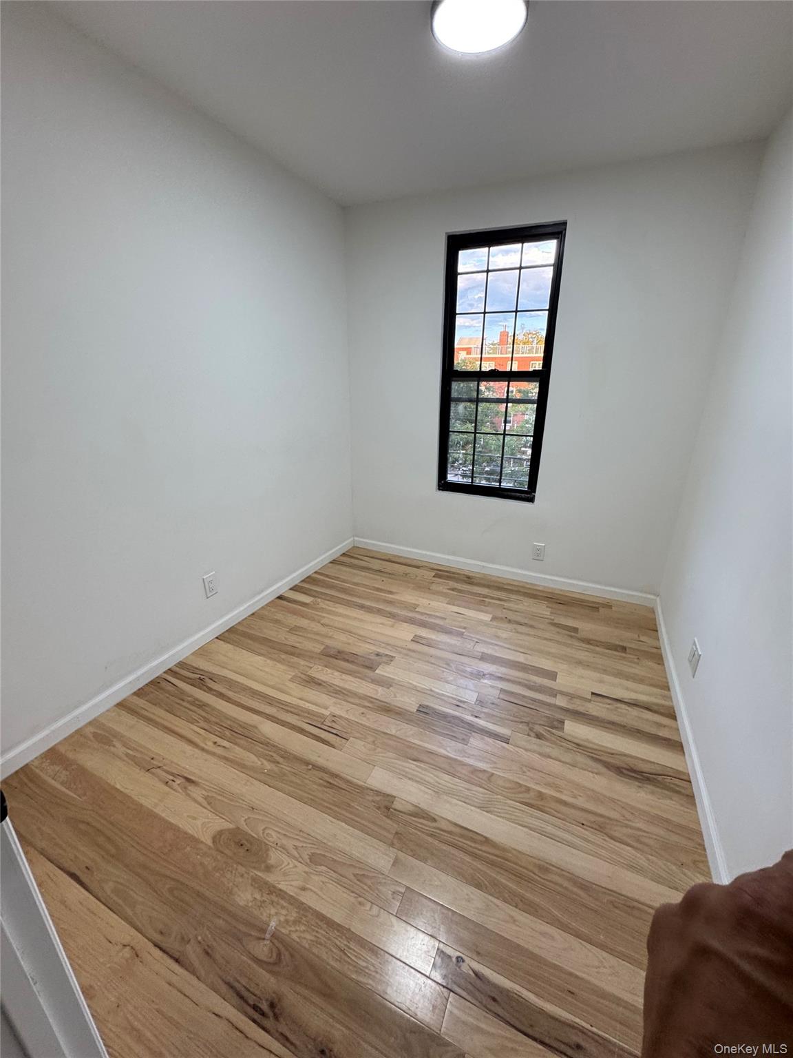 1827 Amethyst Street, Unit 2 Bronx, NY 10462 - Photo 6 of 9 a view of empty room with window