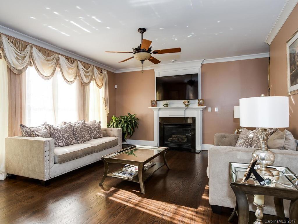 3223 Millstone Creek Road, Unit 2 Lancaster, SC 29720 - Photo 12 of 24 a living room with furniture a fireplace and a flat screen tv