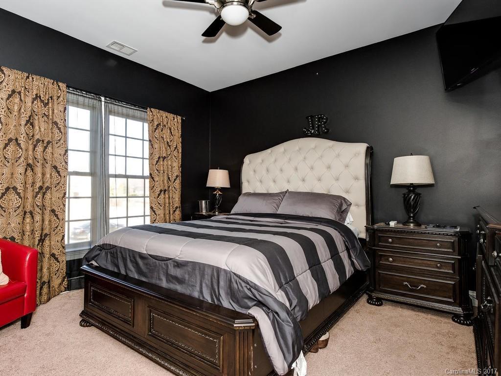 3223 Millstone Creek Road, Unit 2 Lancaster, SC 29720 - Photo 15 of 24 a bedroom with a bed and a night stand