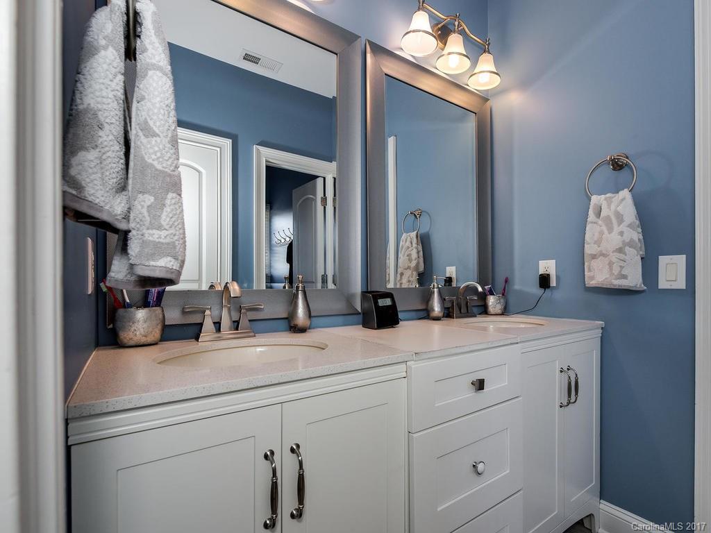3223 Millstone Creek Road, Unit 2 Lancaster, SC 29720 - Photo 18 of 24 a bathroom with a double vanity sink mirror and vanity