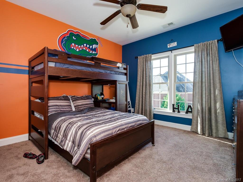 3223 Millstone Creek Road, Unit 2 Lancaster, SC 29720 - Photo 19 of 24 a bedroom with a bed and a large window