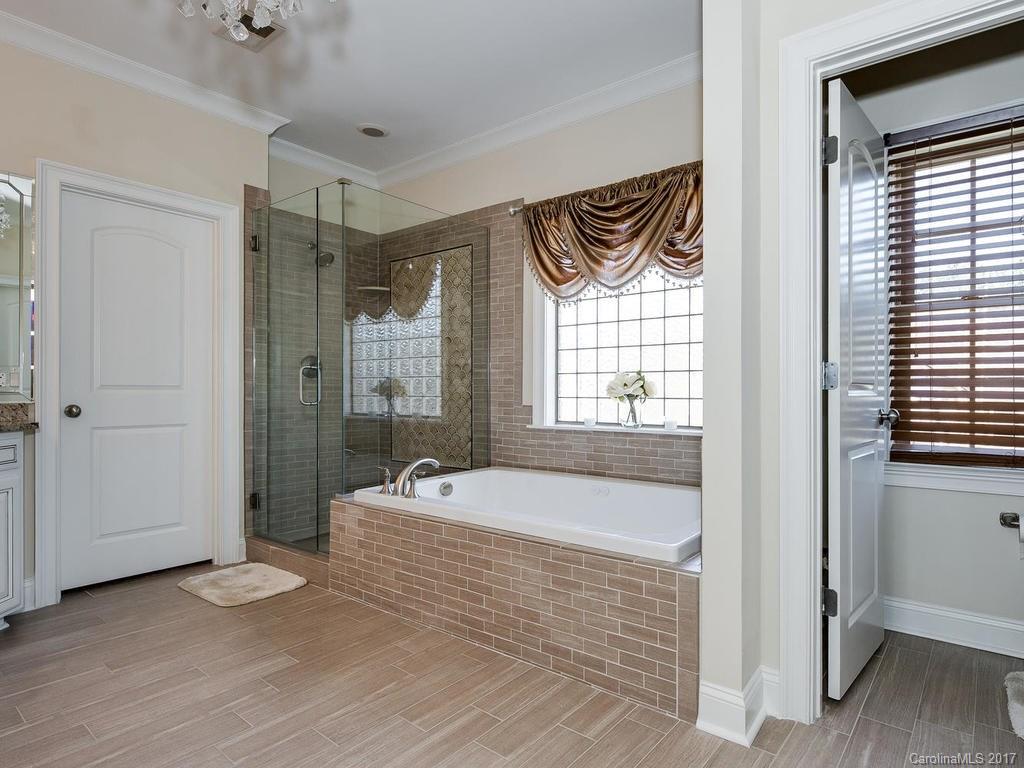 3223 Millstone Creek Road, Unit 2 Lancaster, SC 29720 - Photo 21 of 24 a bathroom with a bathtub and a shower