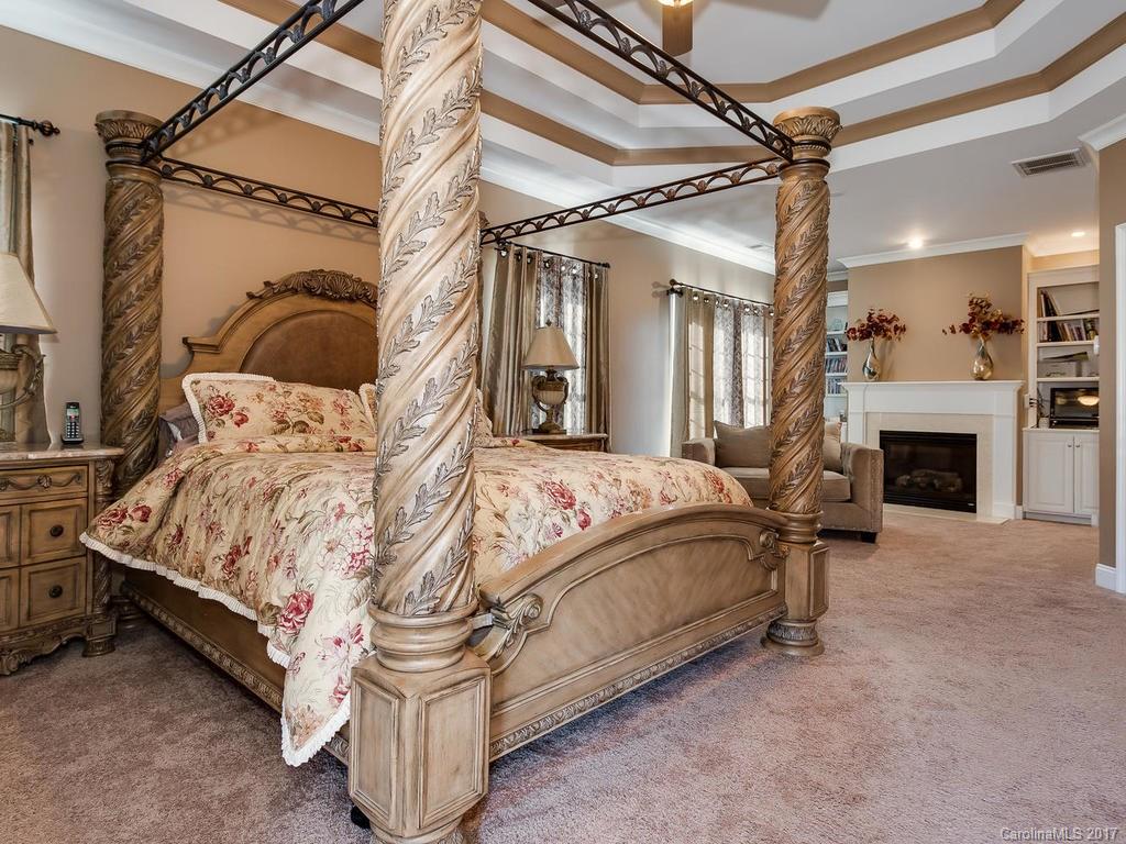 3223 Millstone Creek Road, Unit 2 Lancaster, SC 29720 - Photo 22 of 24 a bedroom with a bed and a fireplace