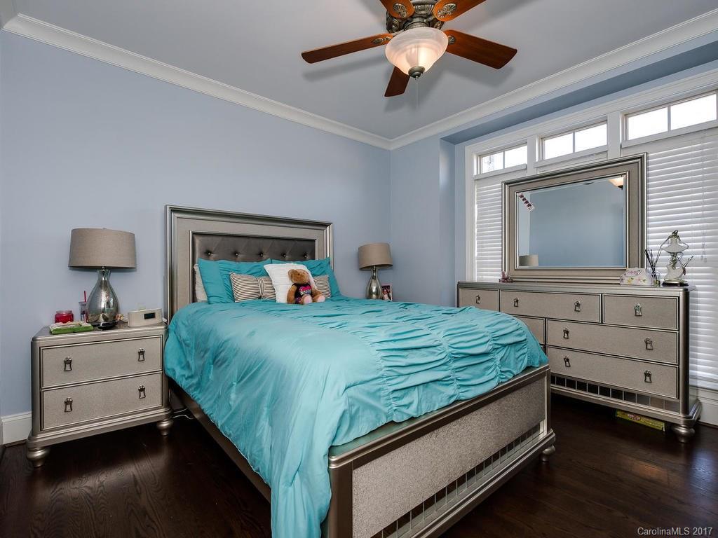 3223 Millstone Creek Road, Unit 2 Lancaster, SC 29720 - Photo 6 of 24 a bedroom with a bed and a chandelier