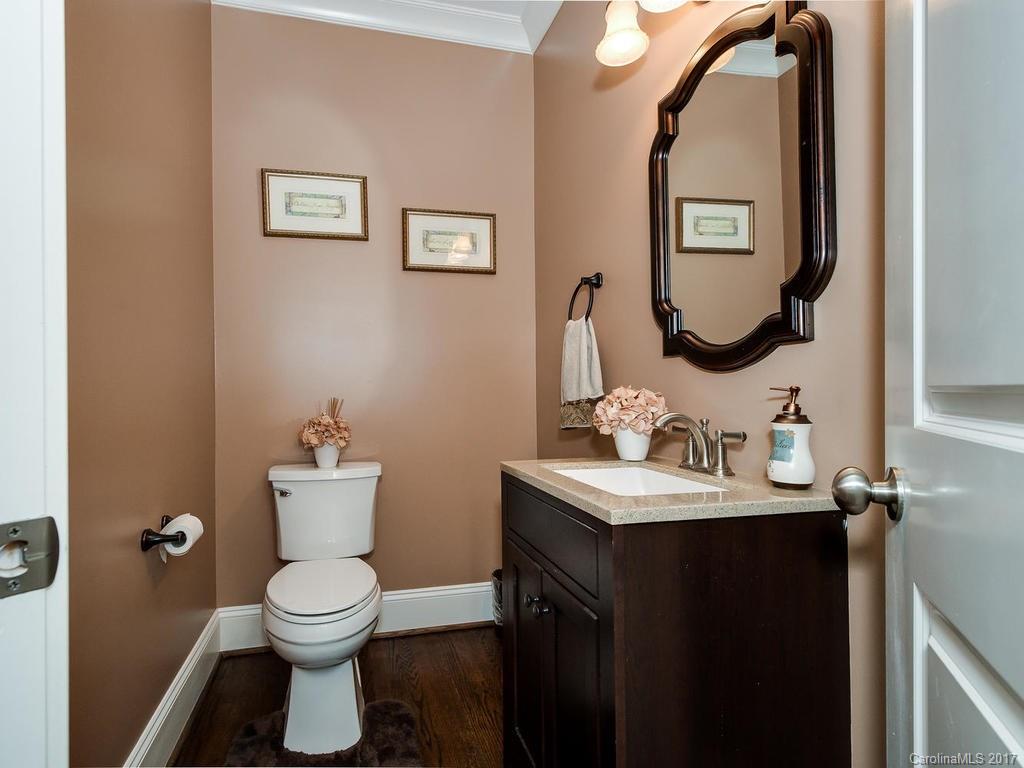 3223 Millstone Creek Road, Unit 2 Lancaster, SC 29720 - Photo 8 of 24 a bathroom with a toilet sink and mirror