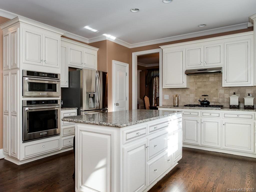3223 Millstone Creek Road, Unit 2 Lancaster, SC 29720 - Photo 10 of 24 a kitchen with white cabinets and stainless steel appliances