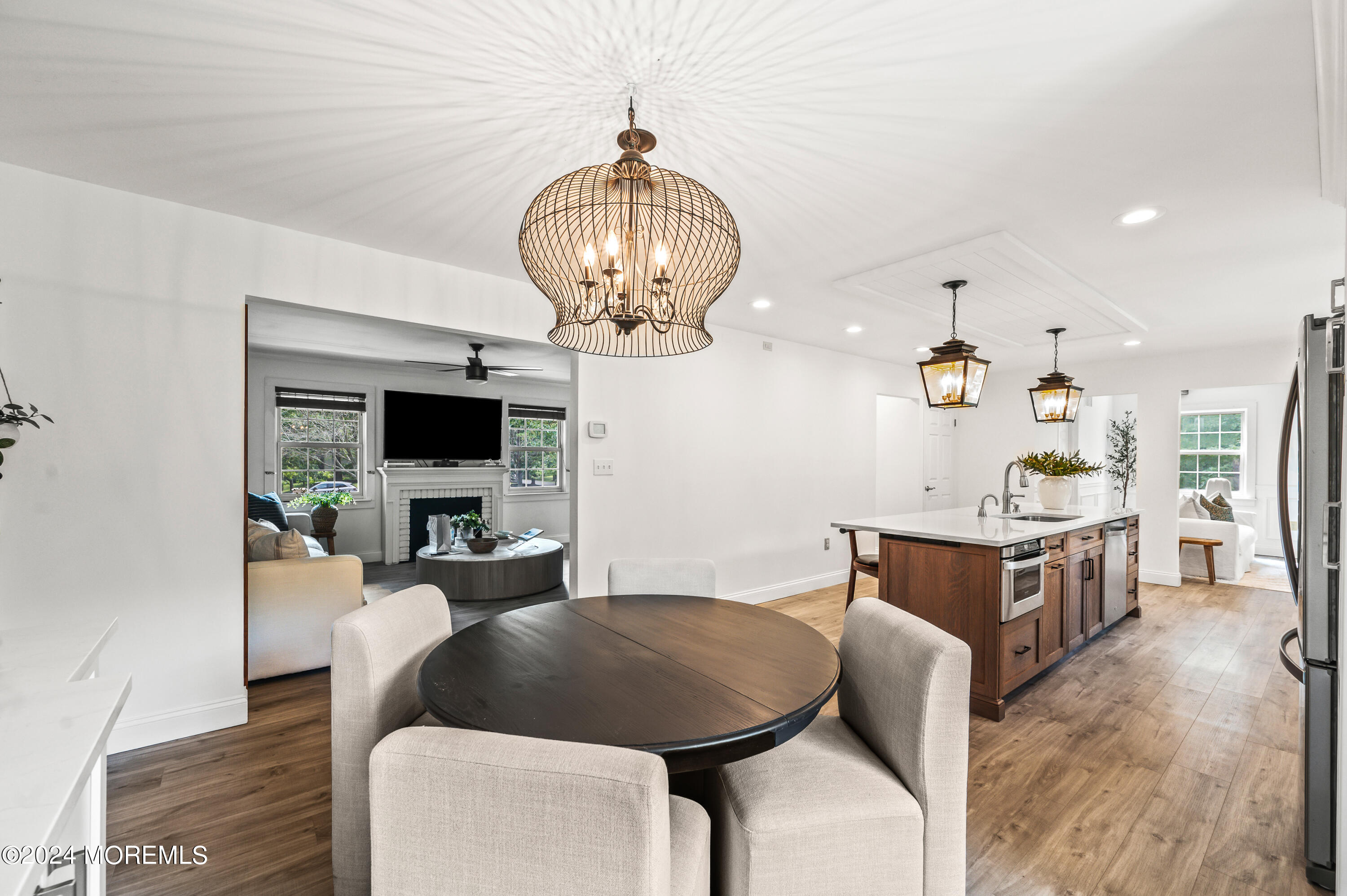 17 Mary Beth Lane Jackson, NJ 08527 - Photo 11 of 61 a living room with furniture a chandelier and a flat screen tv