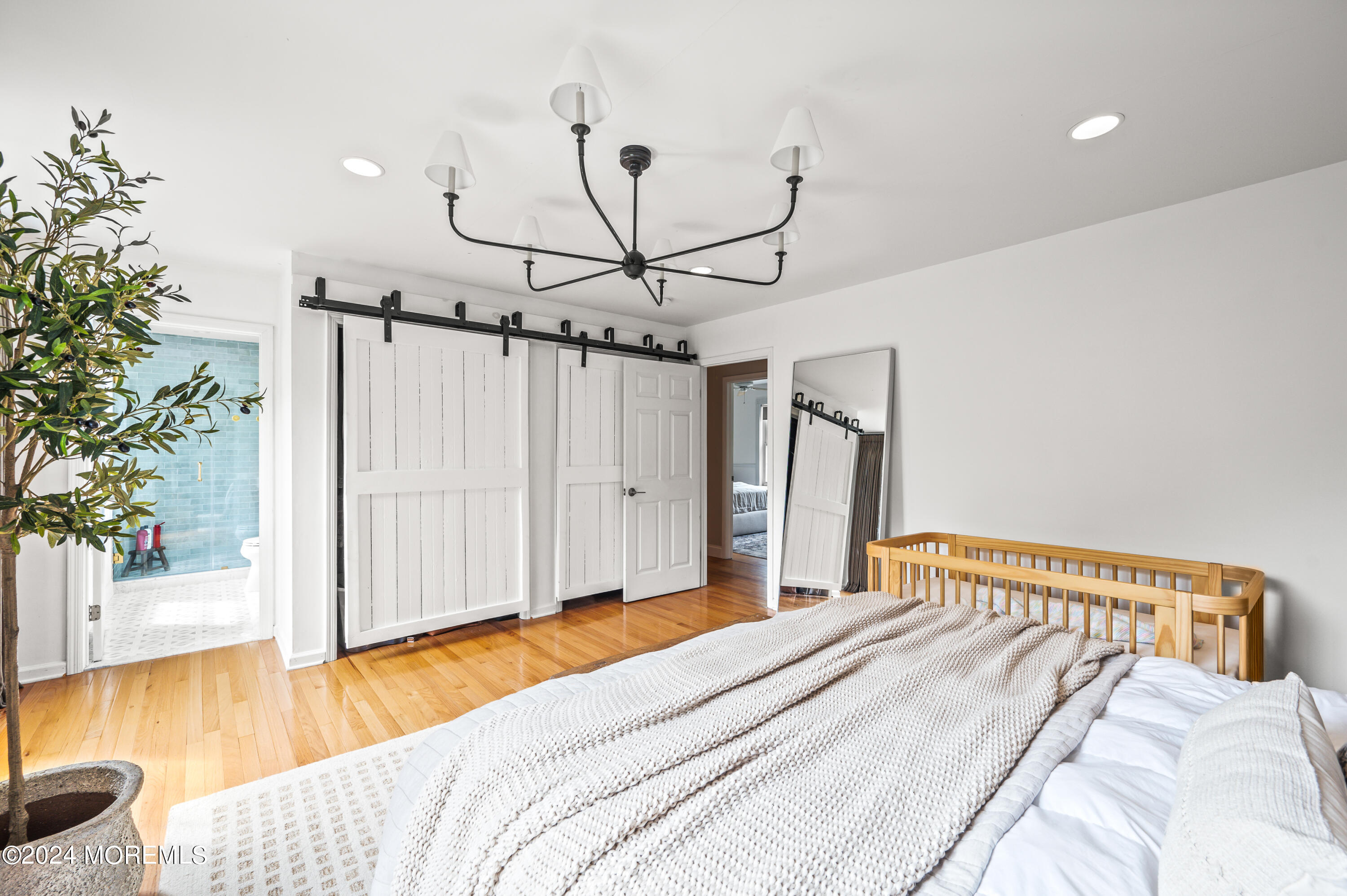 17 Mary Beth Lane Jackson, NJ 08527 - Photo 21 of 61 a bedroom with a bed and wooden floor