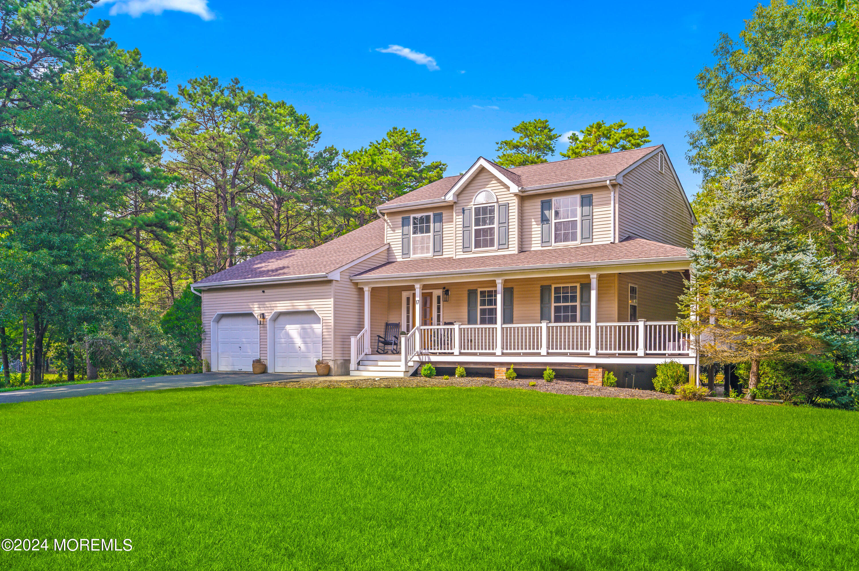 17 Mary Beth Lane Jackson, NJ 08527 - Photo 25 of 61 a view of a brick house with a big yard and large trees