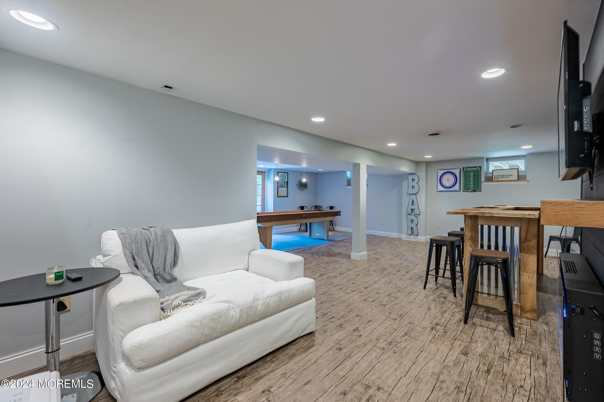 17 Mary Beth Lane Jackson, NJ 08527 - Photo 29 of 61 a living room with furniture and a dining table with wooden floor