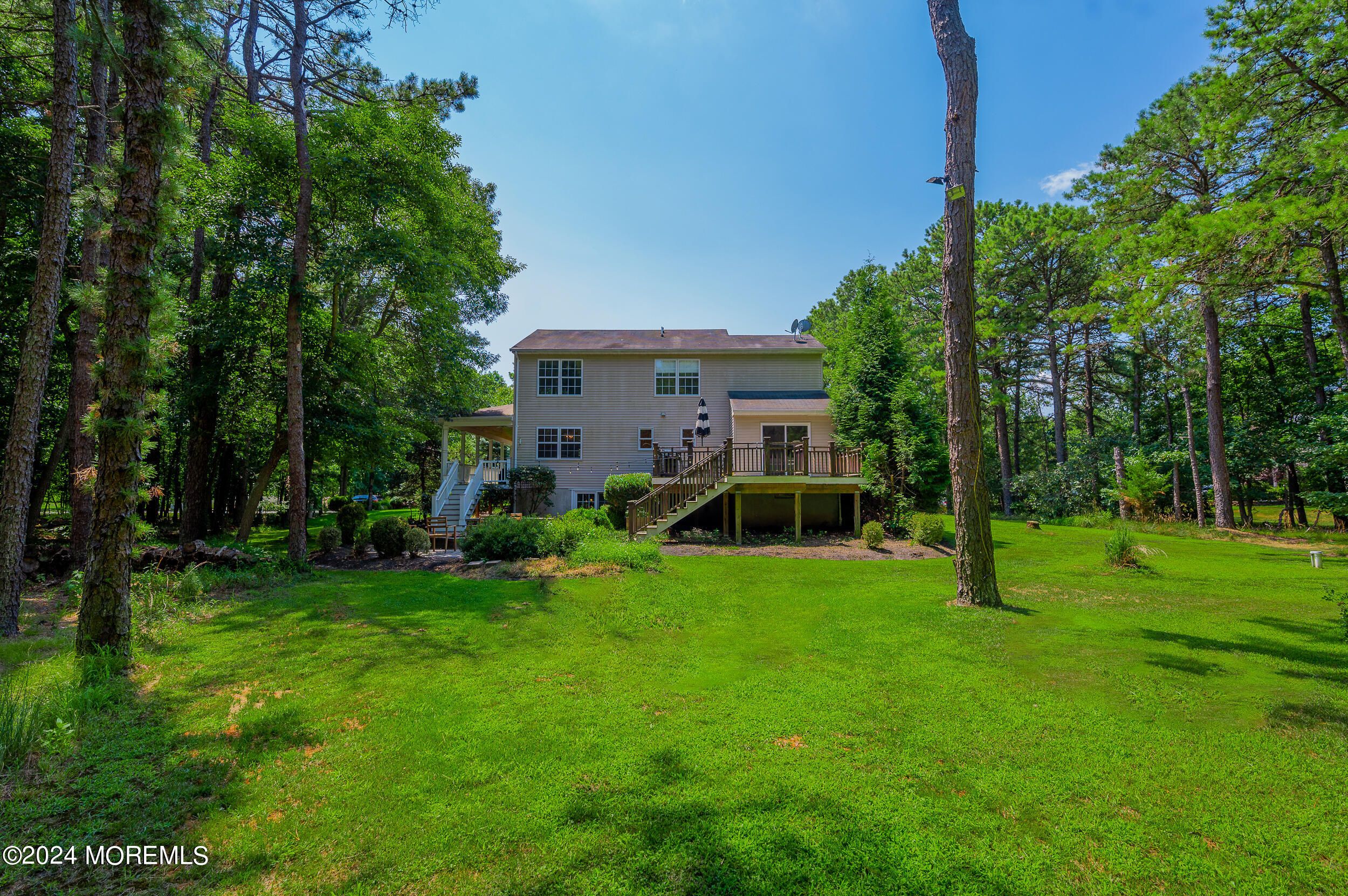 17 Mary Beth Lane Jackson, NJ 08527 - Photo 51 of 61 a view of a house with a big yard and potted plants and large trees