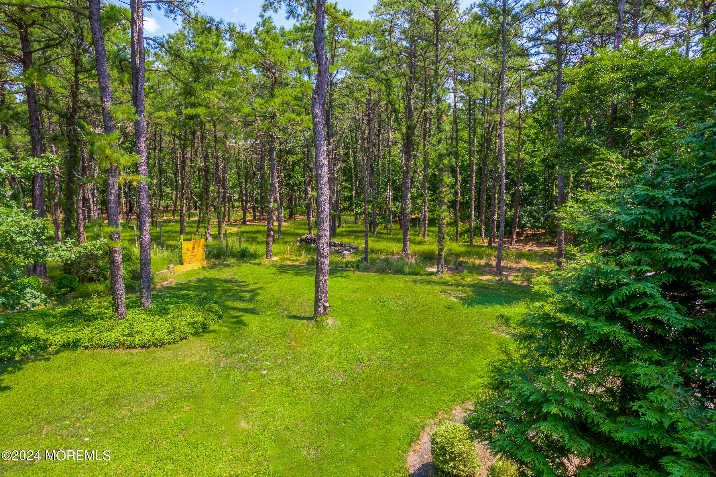 17 Mary Beth Lane Jackson, NJ 08527 - Photo 58 of 61 a view of a backyard with a small cabin
