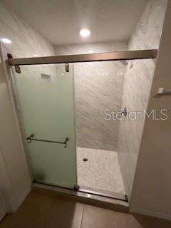 5911 Southwest 84th Street Gainesville, FL 32608 - Photo 12 of 30 a bathroom with a shower and a sink