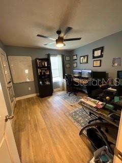 5911 Southwest 84th Street Gainesville, FL 32608 - Photo 17 of 30 a living room with furniture and a flat screen tv