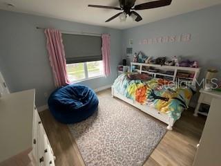 5911 Southwest 84th Street Gainesville, FL 32608 - Photo 22 of 30 a bed room with a bed and a chair