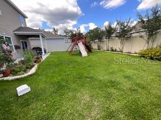 5911 Southwest 84th Street Gainesville, FL 32608 - Photo 26 of 30 a front view of a house with garden