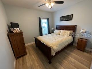 5911 Southwest 84th Street Gainesville, FL 32608 - Photo 5 of 30 a bedroom with bed and a window