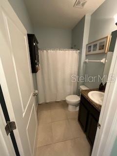 5911 Southwest 84th Street Gainesville, FL 32608 - Photo 6 of 30 a bathroom with a sink toilet and shower