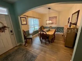 a dining room with furniture and window