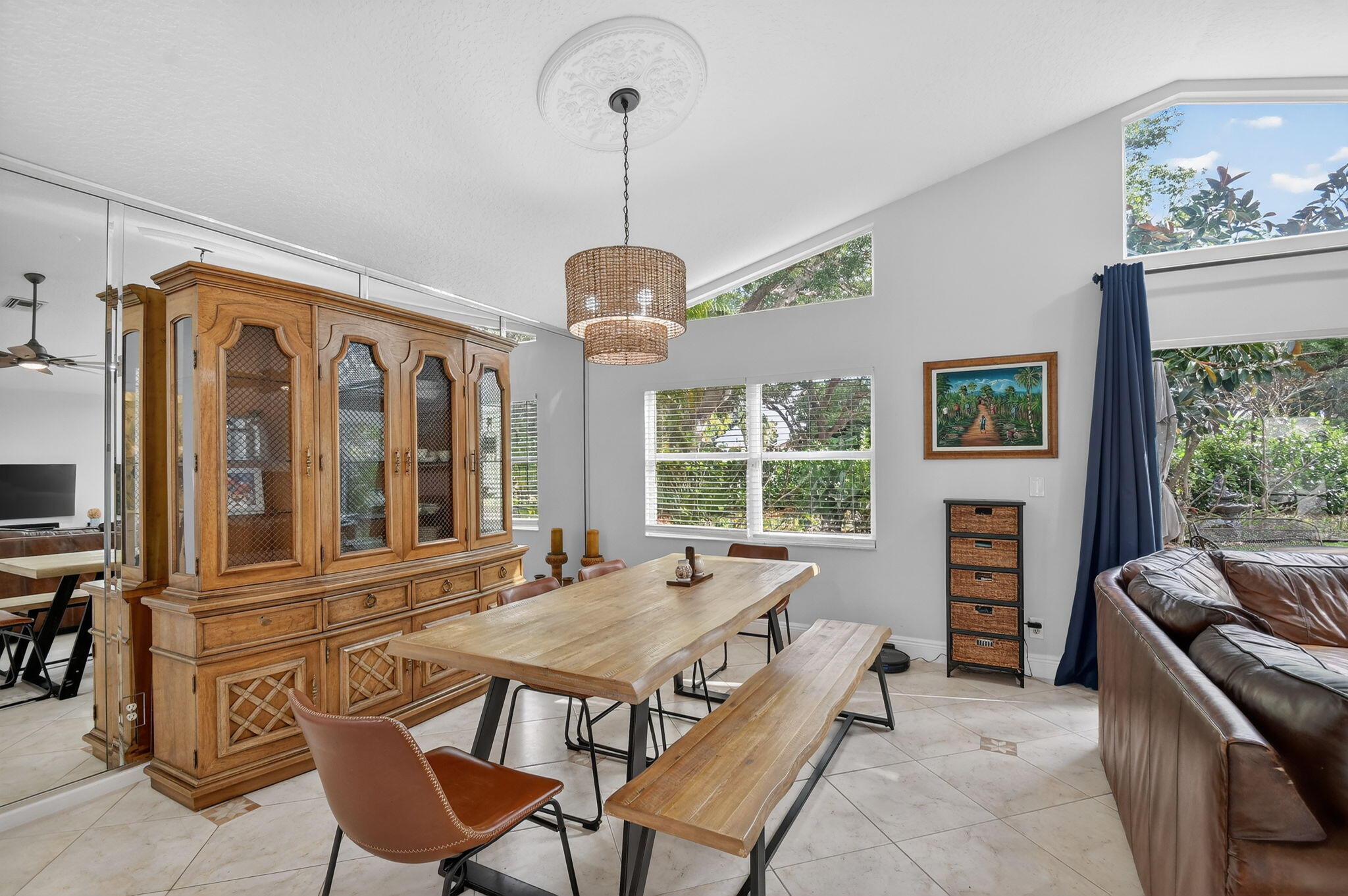 2769 Pointe Circle Greenacres, FL 33413 - Photo 12 of 48 a dining room with furniture a chandelier and window