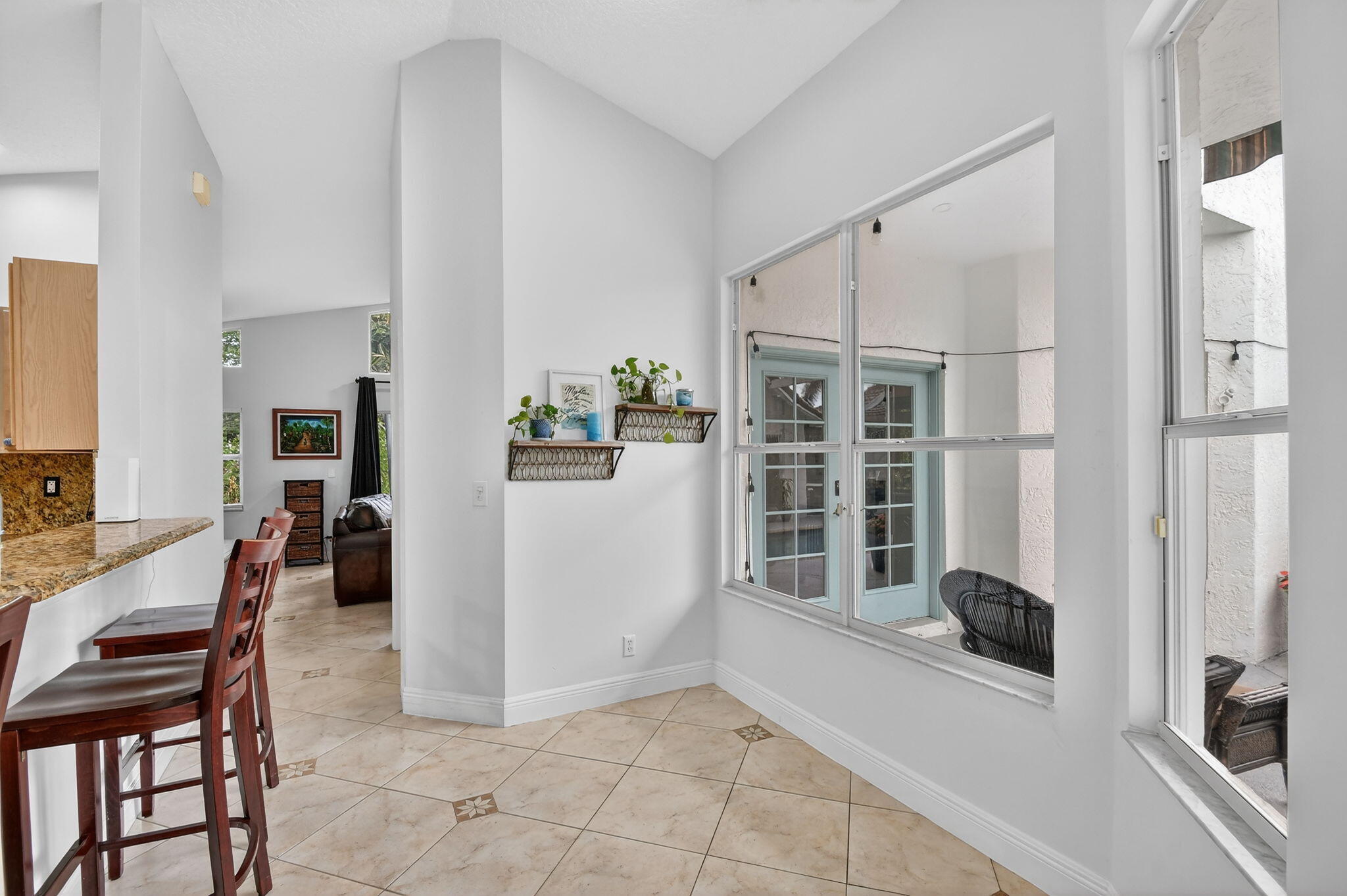 2769 Pointe Circle Greenacres, FL 33413 - Photo 14 of 48 a view of a livingroom with furniture and windows