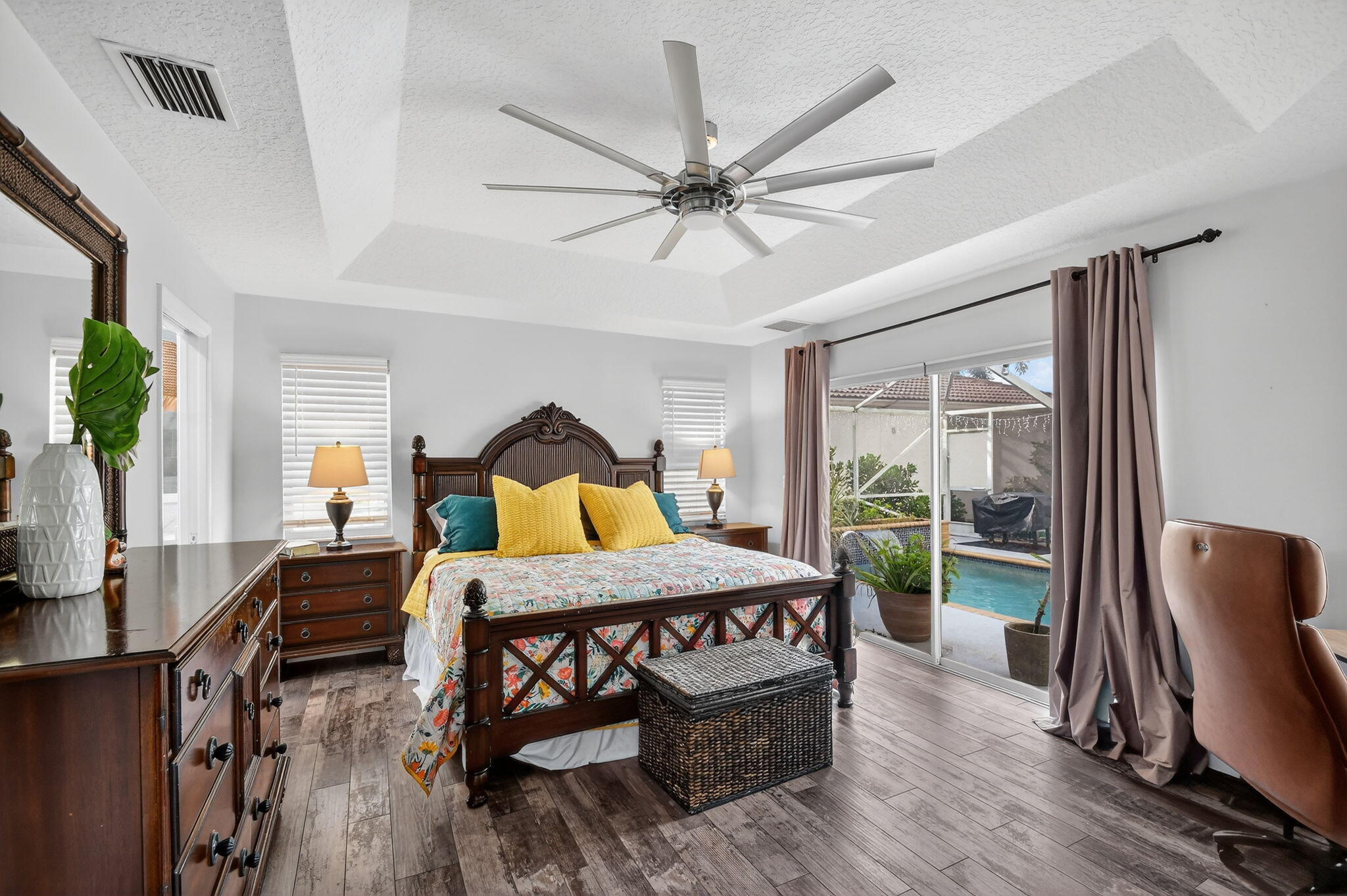 2769 Pointe Circle Greenacres, FL 33413 - Photo 21 of 48 a bedroom with a bed a table and chair
